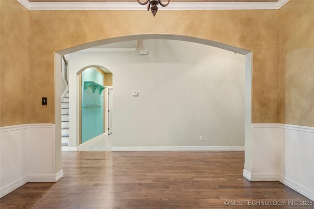 9722 S 75th E Ave, Tulsa, OK 74133 - spare room with wood finished floors, arched walkways, and crown molding