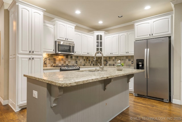 9722 S 75th E Ave, Tulsa, OK 74133 - kitchen with stainless steel appliances, dark wood-style flooring, a breakfast bar, tasteful backsplash, and crown molding