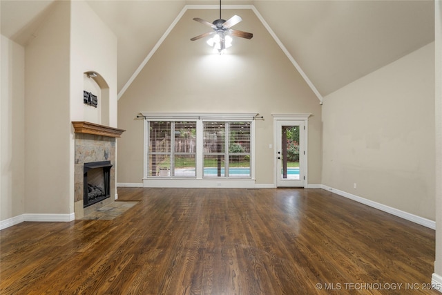 9722 S 75th E Ave, Tulsa, OK 74133 - unfurnished living room with high vaulted ceiling, a fireplace with flush hearth, ceiling fan, and wood finished floors