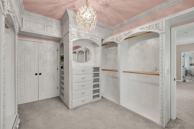 4405 Ithica St, Broken Arrow, OK 74012 - spacious closet with light colored carpet, a chandelier, and arched walkways