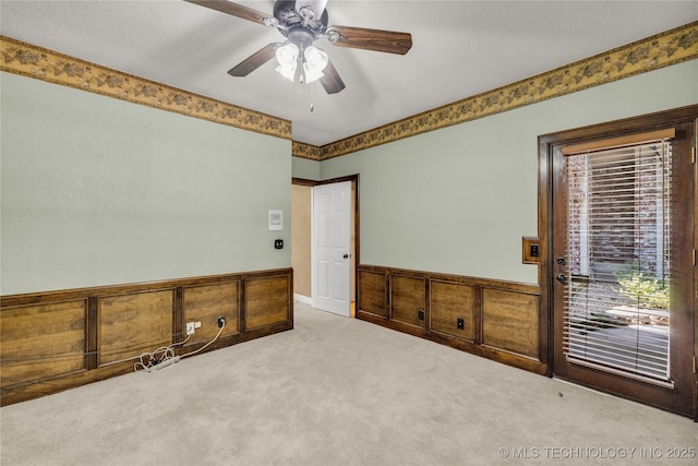 4405 Ithica St, Broken Arrow, OK 74012 - carpeted empty room with a wainscoted wall and a ceiling fan