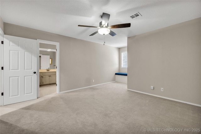 4405 Ithica St, Broken Arrow, OK 74012 - unfurnished bedroom featuring light carpet, ensuite bath, and a ceiling fan