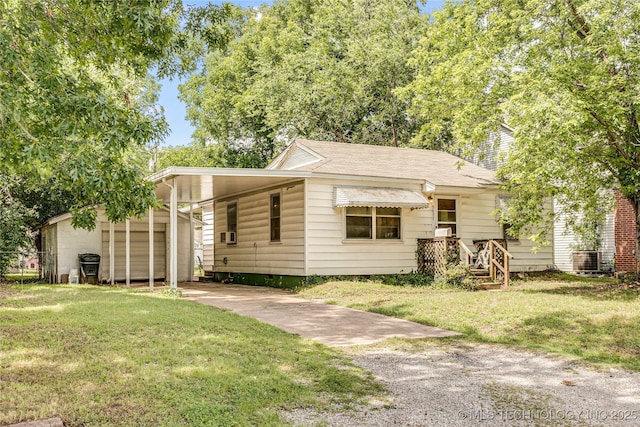5677 W 3rd St, Tulsa, OK 74127 - view of front of property featuring driveway, a front lawn, and a carport