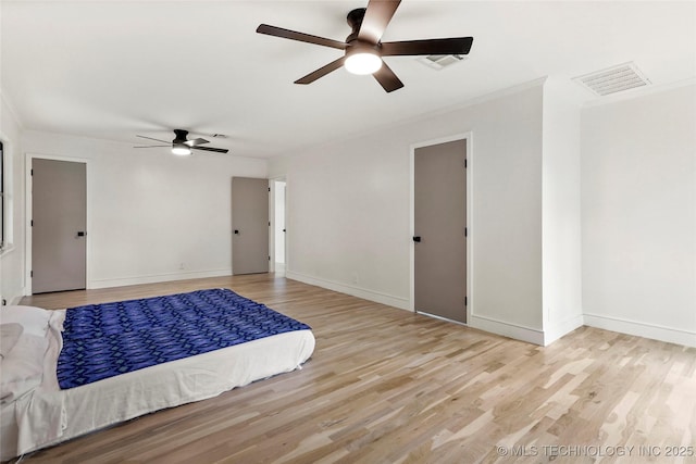 2936 E 75th St, Tulsa, OK 74136 - bedroom with wood finished floors, crown molding, and ceiling fan