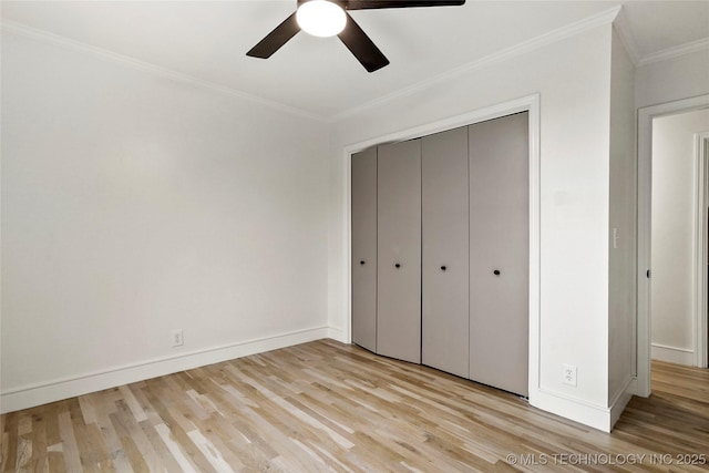 2936 E 75th St, Tulsa, OK 74136 - unfurnished bedroom with light wood-style floors, ornamental molding, a closet, and a ceiling fan