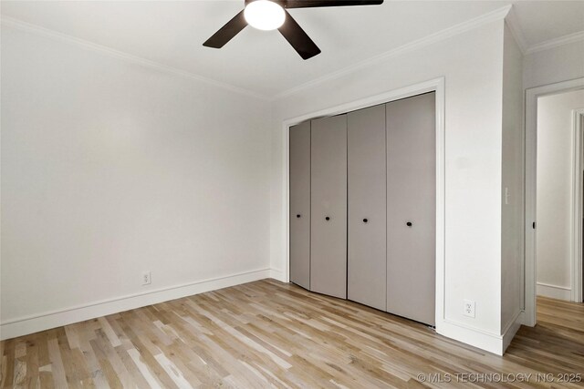 2936 E 75th St, Tulsa, OK 74136 - unfurnished bedroom featuring light wood-type flooring, crown molding, a closet, and ceiling fan