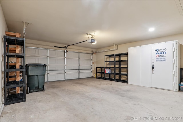 2110 S Javine Ct, Skiatook, OK 74070 - garage featuring a garage door opener