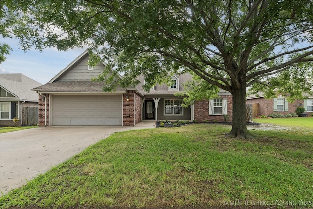 2110 S Javine Ct, Skiatook, OK 74070 - view of front of home with an attached garage, concrete driveway, a front yard, and brick siding