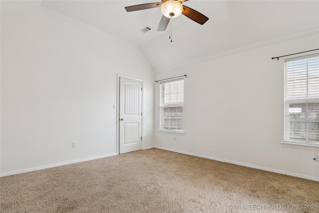 2110 S Javine Ct, Skiatook, OK 74070 - carpeted empty room with vaulted ceiling, a ceiling fan, and healthy amount of natural light