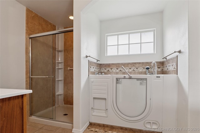 2110 S Javine Ct, Skiatook, OK 74070 - full bath featuring a stall shower, tile patterned floors, and vanity