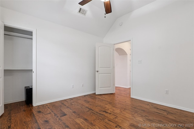 2110 S Javine Ct, Skiatook, OK 74070 - unfurnished bedroom featuring vaulted ceiling, wood finished floors, ceiling fan, and a closet