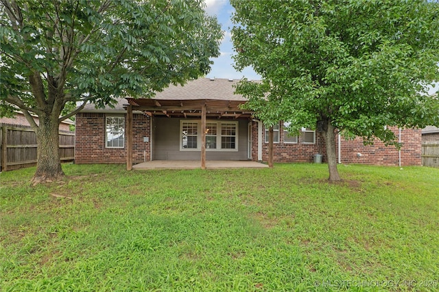 2110 S Javine Ct, Skiatook, OK 74070 - rear view of house featuring brick siding, a patio, and roof with shingles