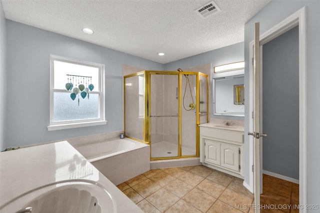 7416 S 109th E Ave, Tulsa, OK 74133 - full bathroom with vanity, a shower stall, a bath, tile patterned flooring, and a textured ceiling