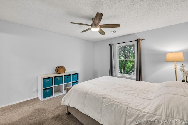 7416 S 109th E Ave, Tulsa, OK 74133 - bedroom with carpet flooring, a textured ceiling, and a ceiling fan