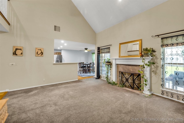 7416 S 109th E Ave, Tulsa, OK 74133 - unfurnished living room featuring high vaulted ceiling, carpet flooring, a tile fireplace, and ceiling fan