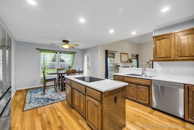 7416 S 109th E Ave, Tulsa, OK 74133 - kitchen featuring appliances with stainless steel finishes, a kitchen island, a ceiling fan, light countertops, and recessed lighting
