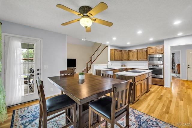 7416 S 109th E Ave, Tulsa, OK 74133 - dining room featuring stairs, light wood-style floors, a ceiling fan, and recessed lighting