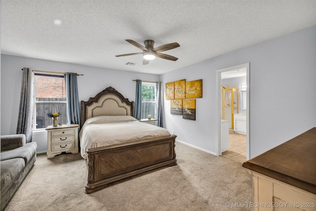 7416 S 109th E Ave, Tulsa, OK 74133 - bedroom featuring light carpet, ensuite bath, a textured ceiling, and ceiling fan