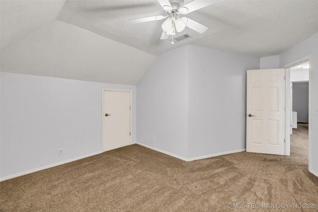 7416 S 109th E Ave, Tulsa, OK 74133 - additional living space featuring carpet, vaulted ceiling, a textured ceiling, and a ceiling fan