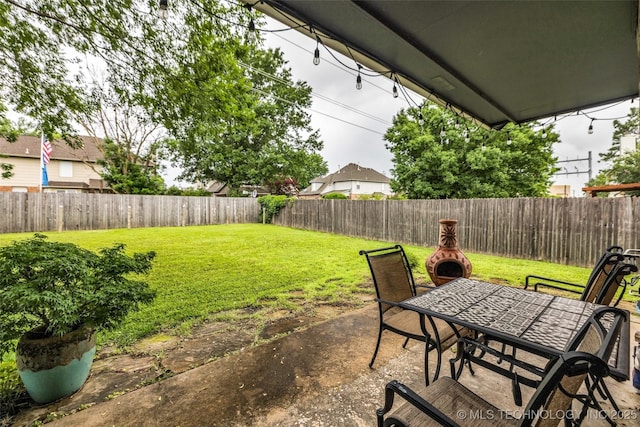 7416 S 109th E Ave, Tulsa, OK 74133 - fenced backyard with a patio and outdoor dining space