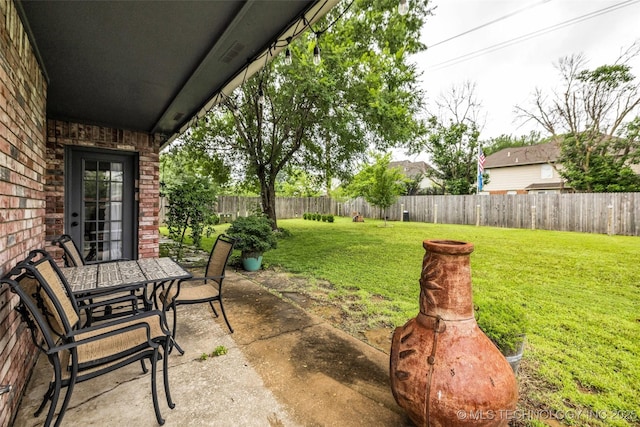 7416 S 109th E Ave, Tulsa, OK 74133 - fenced backyard with a patio and outdoor dining area