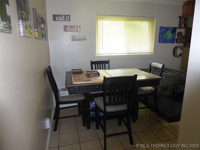 2414 S 126th E Ave, Tulsa, OK 74129 - dining room with light tile patterned flooring and ornamental molding