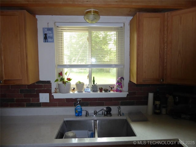 2414 S 126th E Ave, Tulsa, OK 74129 - kitchen featuring tasteful backsplash and light countertops