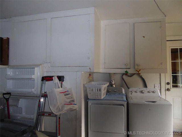 2414 S 126th E Ave, Tulsa, OK 74129 - washroom with cabinet space and washer and clothes dryer