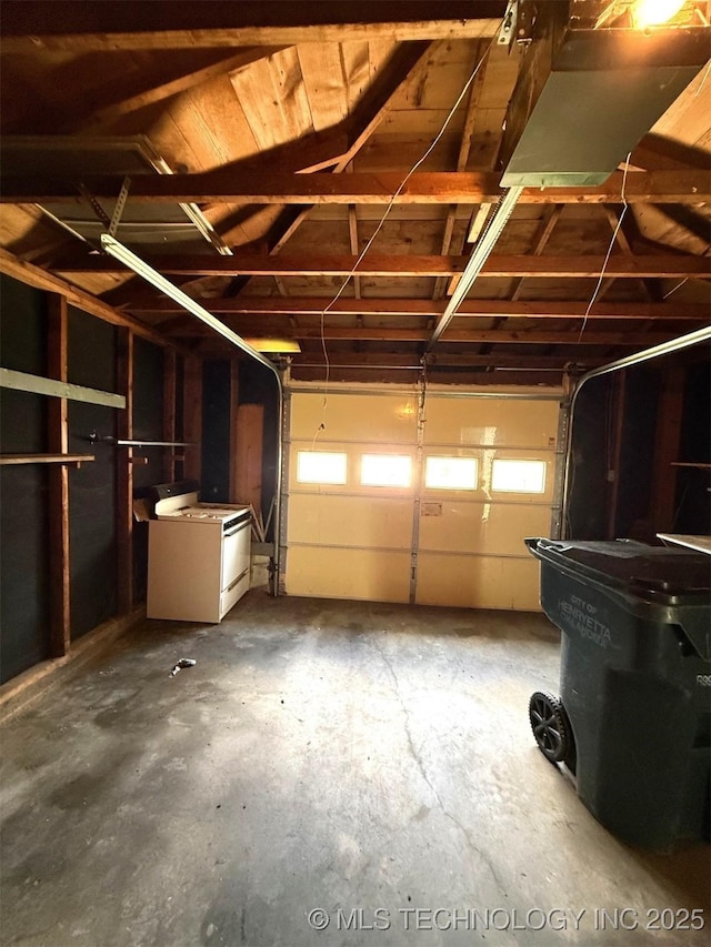 903 W Broadway St, Henryetta, OK 74437 - garage featuring washer / dryer