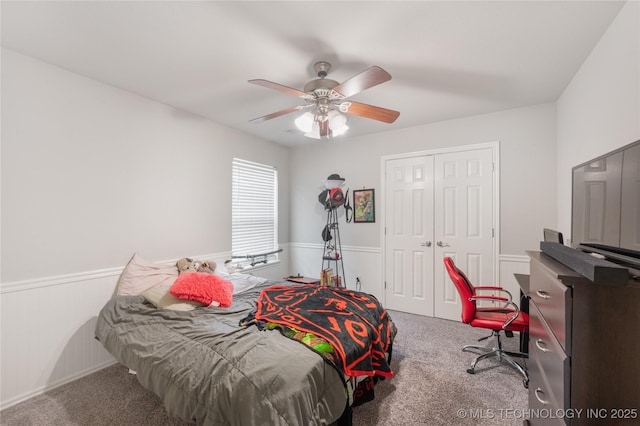14220 S Vandalia Ave, Bixby, OK 74008 - carpeted bedroom with a closet, a ceiling fan, and wainscoting