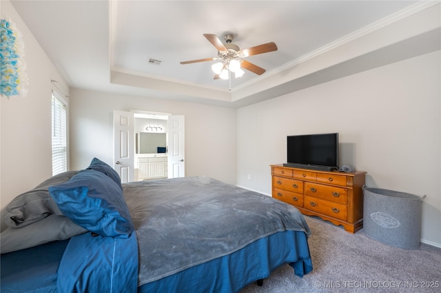 14220 S Vandalia Ave, Bixby, OK 74008 - carpeted bedroom with a raised ceiling, a ceiling fan, connected bathroom, and ornamental molding