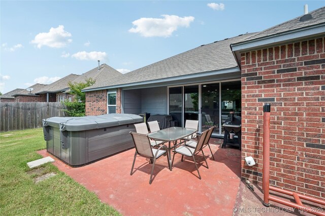 14220 S Vandalia Ave, Bixby, OK 74008 - view of patio featuring a hot tub and outdoor dining area