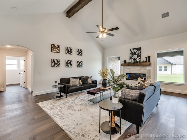 27742 E 109th St S, Coweta, OK 74429 - living area with arched walkways, dark wood-style flooring, a ceiling fan, high vaulted ceiling, and beam ceiling