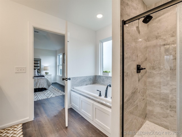 27742 E 109th St S, Coweta, OK 74429 - bathroom with a garden tub, ensuite bath, a shower stall, and wood finished floors