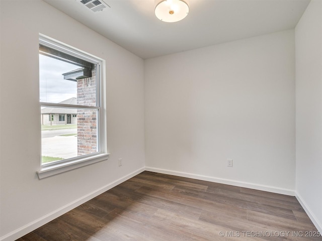 27742 E 109th St S, Coweta, OK 74429 - spare room with dark wood-type flooring and baseboards
