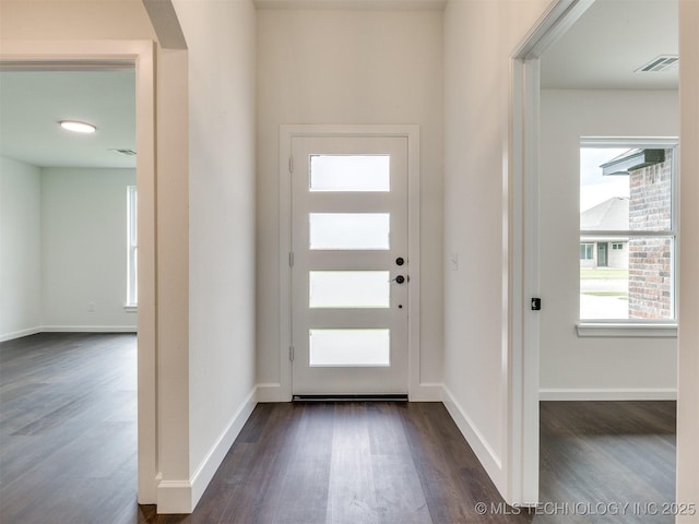 27742 E 109th St S, Coweta, OK 74429 - foyer entrance featuring dark wood finished floors, plenty of natural light, and arched walkways