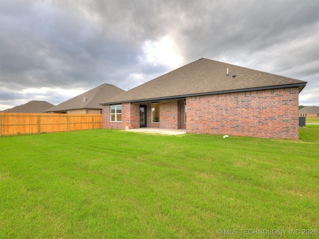 27742 E 109th St S, Coweta, OK 74429 - rear view of house with a shingled roof, a patio, and brick siding