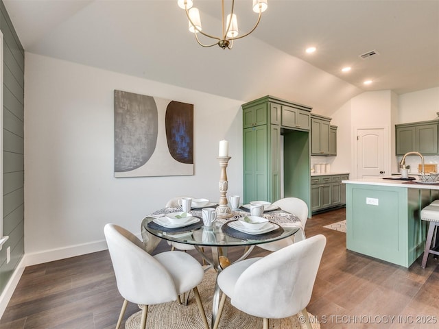 27742 E 109th St S, Coweta, OK 74429 - dining area featuring vaulted ceiling, dark wood finished floors, and a chandelier