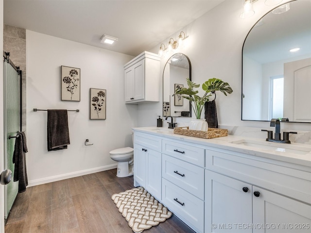 27742 E 109th St S, Coweta, OK 74429 - full bath featuring double vanity, wood finished floors, and a shower with door