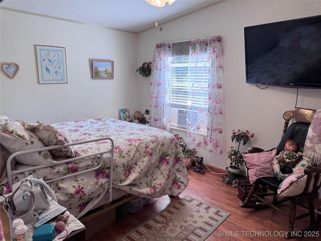 2399 County Road 1405, Skiatook, OK 74070 - bedroom with wood finished floors and ornamental molding