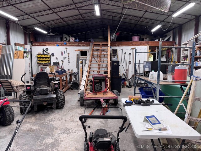 2399 County Road 1405, Skiatook, OK 74070 - garage featuring a workshop area and metal wall