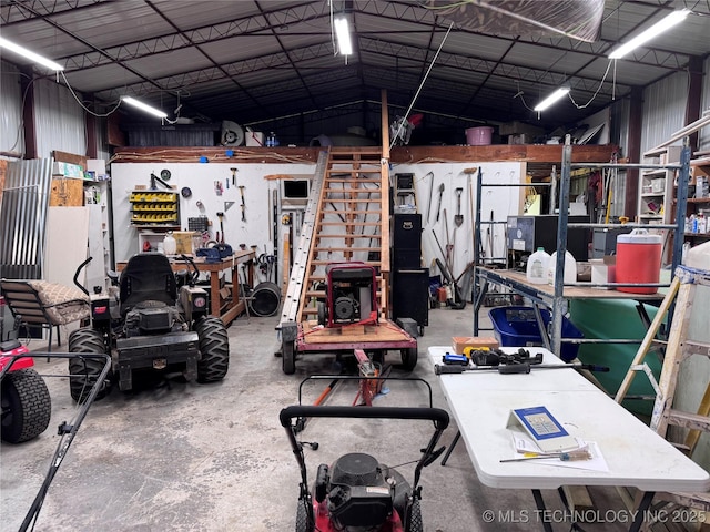 2399 County Road 1405, Skiatook, OK 74070 - garage featuring a workshop area and metal wall