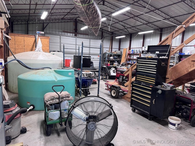 2399 County Road 1405, Skiatook, OK 74070 - garage featuring metal wall and a workshop area