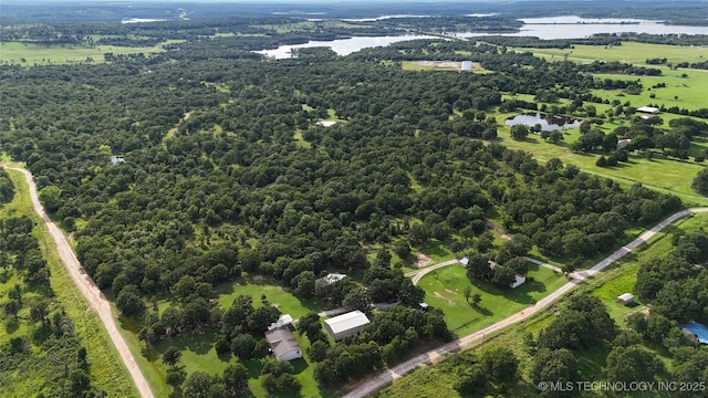 2399 County Road 1405, Skiatook, OK 74070 - aerial overview of property's location with a large body of water and a heavily wooded area