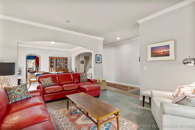 243 E 27th Pl, Tulsa, OK 74114 - living room featuring arched walkways, ornamental molding, stairway, and recessed lighting