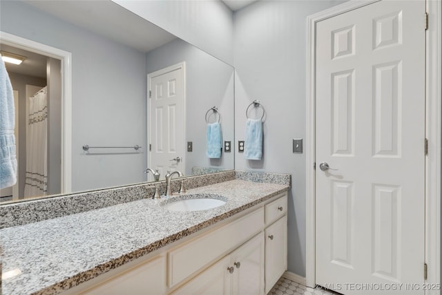 243 E 27th Pl, Tulsa, OK 74114 - full bathroom with vanity and baseboards