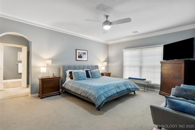243 E 27th Pl, Tulsa, OK 74114 - carpeted bedroom featuring crown molding, arched walkways, and a ceiling fan