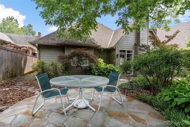 243 E 27th Pl, Tulsa, OK 74114 - view of patio featuring outdoor dining area