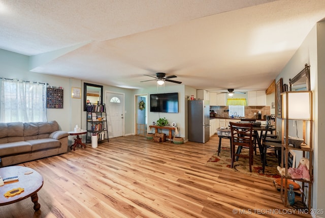 705 S E St, Skiatook, OK 74070 - living room featuring light wood-style flooring and ceiling fan