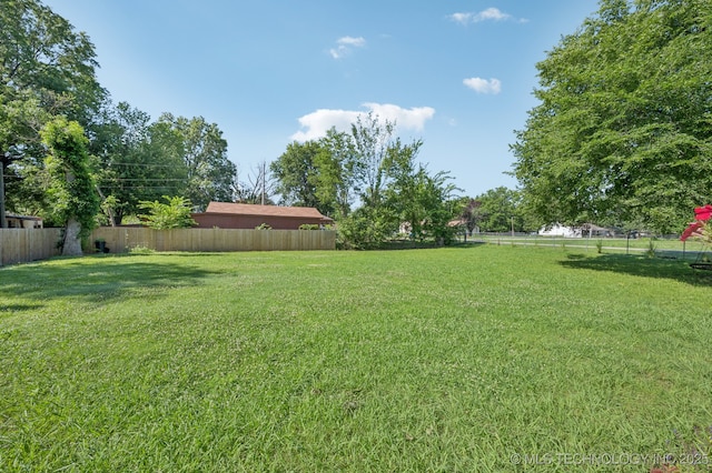 705 S E St, Skiatook, OK 74070 - view of fenced backyard